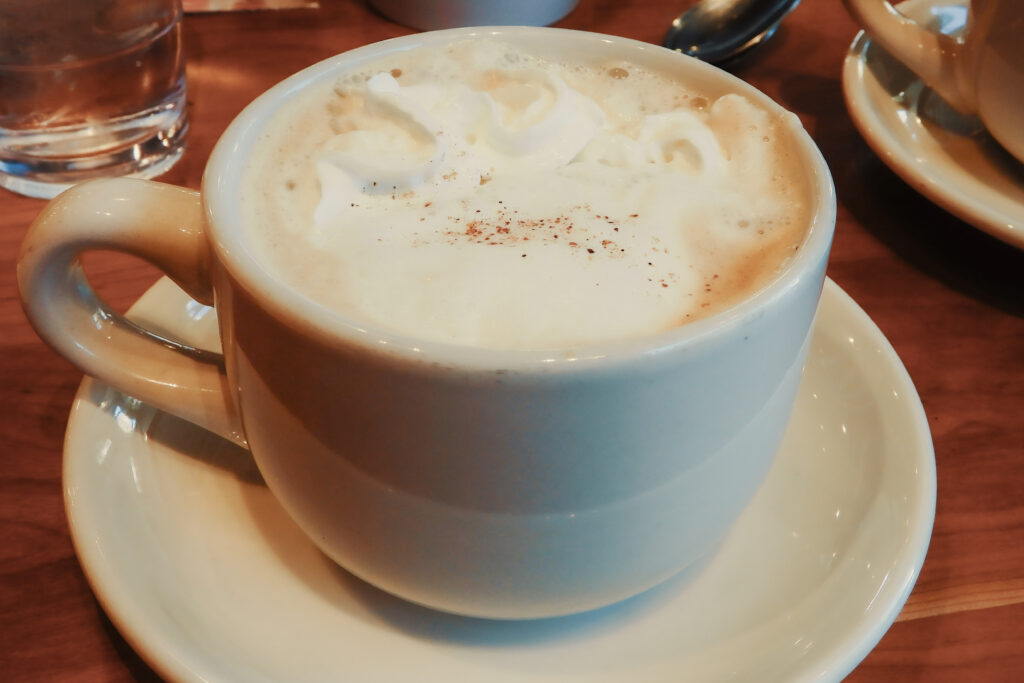 A vanilla latte sits on a table during brunch at Ruby Sunshine for brunch in Nashville